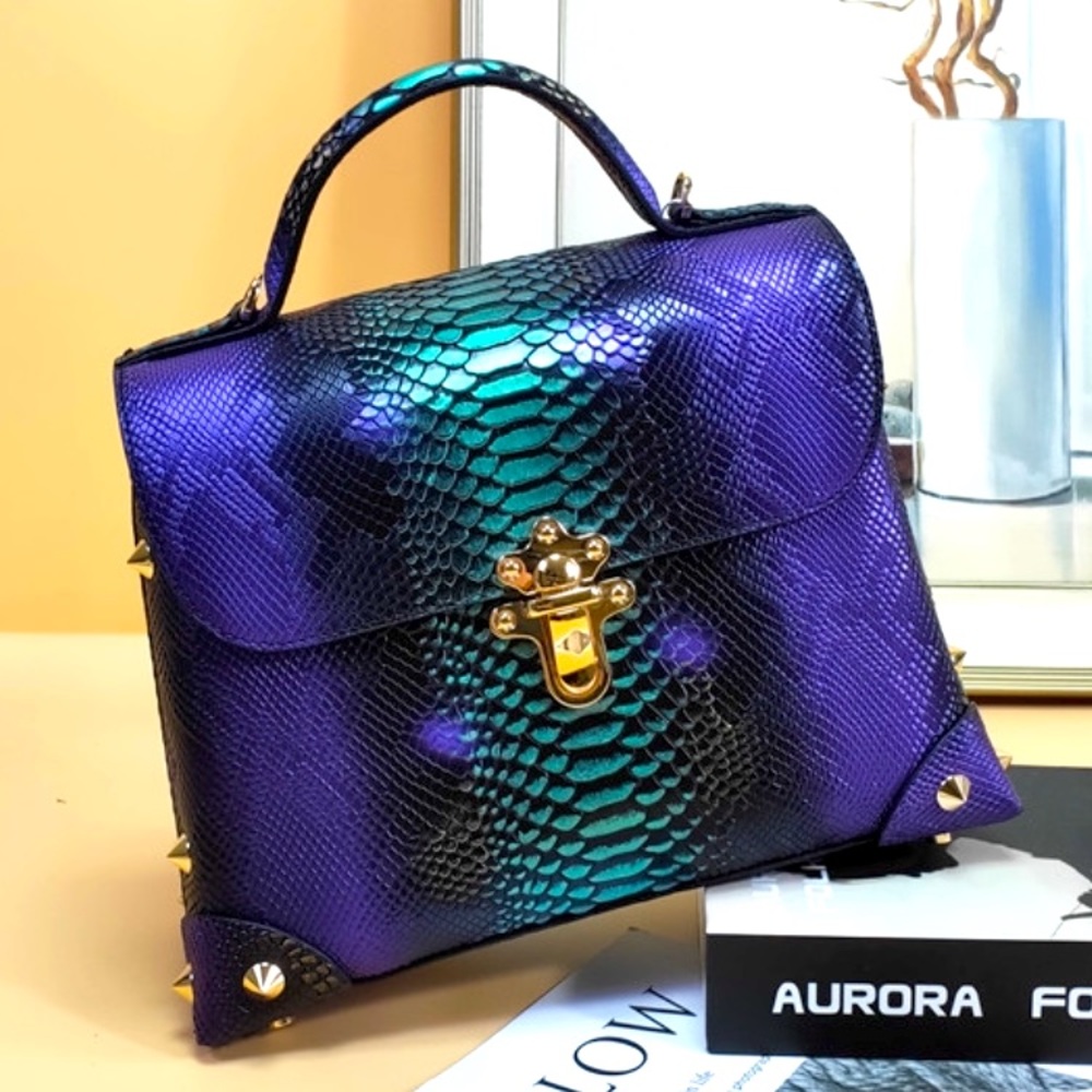 100% leather with embossed snake feature